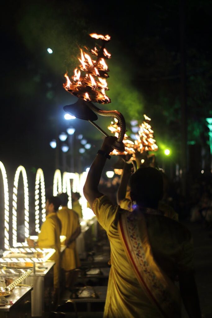 pexels photo 32111234 Devotees perform a vibrant Ganga Aarti ritual on the Ganges River, showcasing Indian cultural heritage.